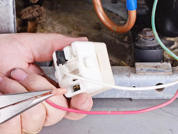 Whirlpool Refrigerator Motor Thermal Protector and Start Relay Assembly Replacement, Disconnect the wires: step 7, image 2 of 3