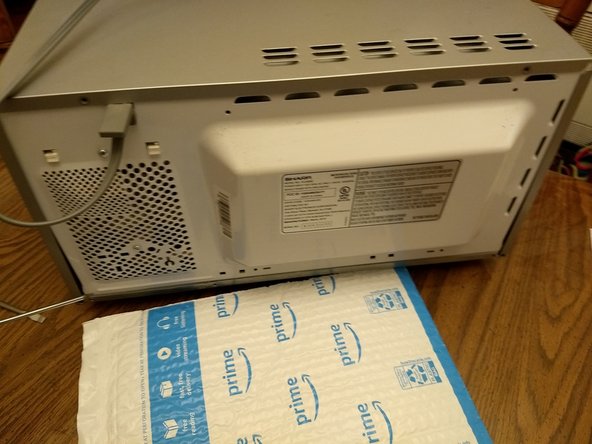 Sharp Microwave Door Switch Replacement, Remove the screws (5 in number)): step 3, image 2 of 3