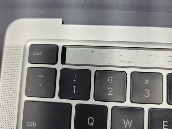 MacBook Pro 13" Two Thunderbolt Ports 2020 Touchbar Removal, Prying Up The LCD of The Touchbar: crwdns2935265:040crwdnd2935265:02crwdnd2935265:02crwdne2935265:0