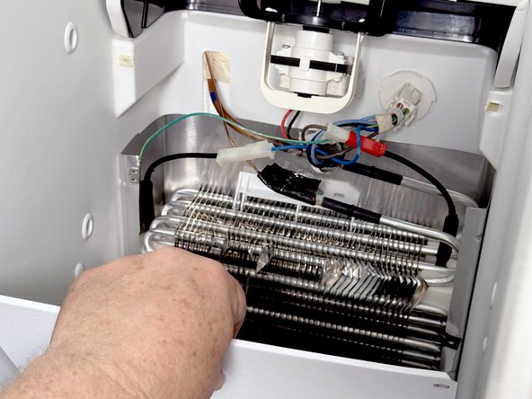 Frigidaire Side-By-Side Refrigerator Evaporator Fan Cover Removal, Remove the lower evaporator cover: crwdns2935265:016crwdnd2935265:02crwdnd2935265:03crwdne2935265:0