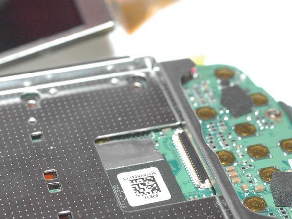 Repairing Casio Exilim EX-Z350 Lens mechanics, Unclip LCD display: crwdns2935265:07crwdnd2935265:02crwdnd2935265:03crwdne2935265:0