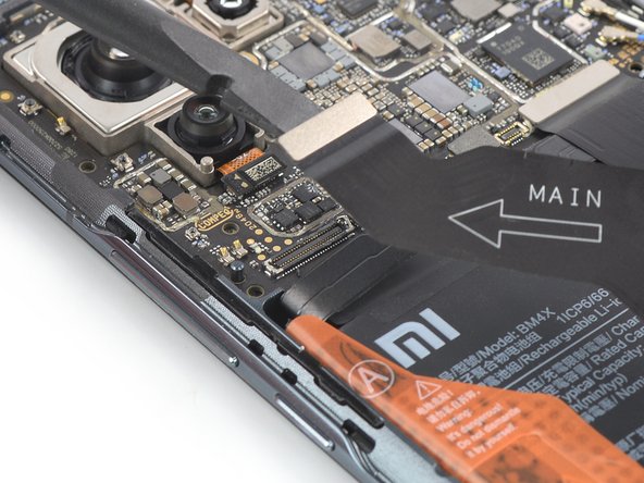 Sostituzione Batteria Mi 11, Disconnetti il cavo di interconnessione sinistro: passo 17, immagine 2 di 2