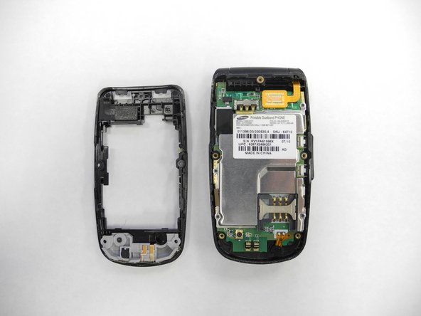 Samsung SGH-A117: Breakdown and Reassembly, Removing the Back Cover: crwdns2935265:04crwdnd2935265:02crwdnd2935265:02crwdne2935265:0