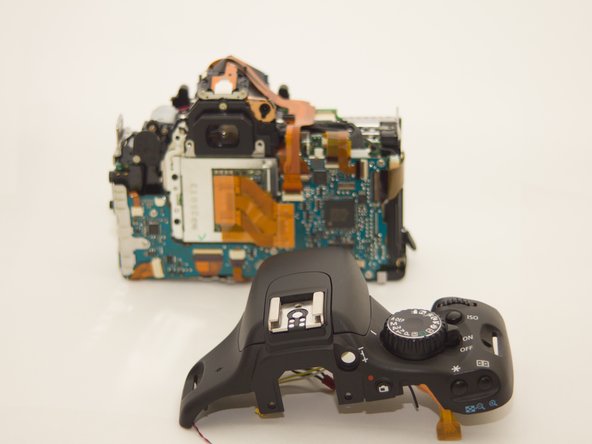 Canon EOS Rebel T2i Top Casing Replacement, Remove top casing and replace with a new casing.: step 6, image 2 of 2