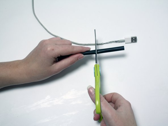 While cutting, keep the length of the heat shrink longer than the length of the frayed or damaged area.