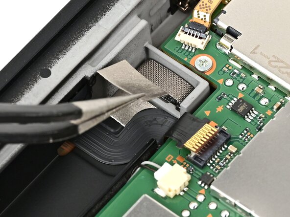 Nintendo Switch 2 Right Joy-Con 2 Connector Replacement, Remove the cable cover: crwdns2935265:037crwdnd2935265:02crwdnd2935265:02crwdne2935265:0