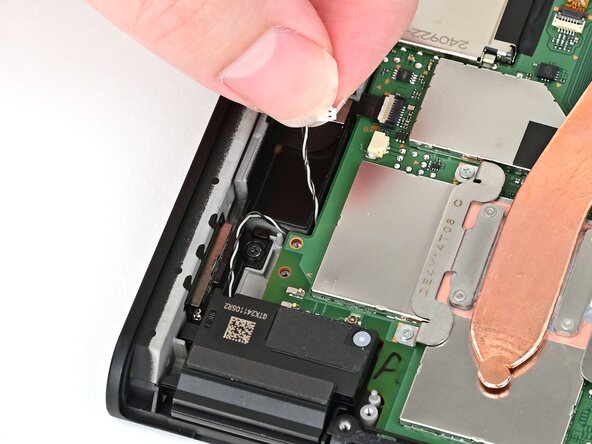 Nintendo Switch 2 Speakers Replacement, Unroute the right speaker cable: crwdns2935265:038crwdnd2935265:02crwdnd2935265:03crwdne2935265:0