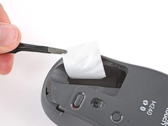 How to Open Your Logitech M240 Wireless Mouse, Remove the sticker: crwdns2935265:04crwdnd2935265:01crwdnd2935265:01crwdne2935265:0