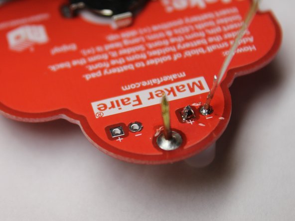 Learn to solder electronics with the Maker Shed Solder Badge!, Continue soldering the LED in place.: crwdns2935265:020crwdnd2935265:02crwdnd2935265:03crwdne2935265:0