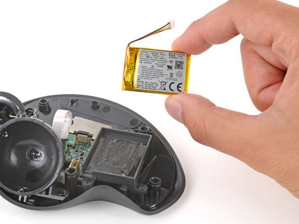 Logitech MX Ergo Battery Replacement, Remove the battery: crwdns2935265:016crwdnd2935265:03crwdnd2935265:03crwdne2935265:0