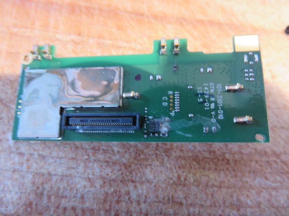 HTC RE Companion Handheld camera disassemby, Pulling one of the boards off, checking for water damage.: step 17, image 2 of 2