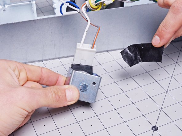 Whirlpool Refrigerator Dispenser Solenoid Replacement, Remove the tape: crwdns2935265:014crwdnd2935265:03crwdnd2935265:03crwdne2935265:0