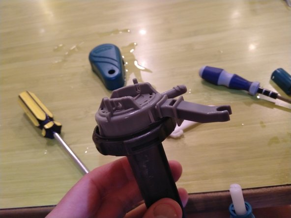 Toto E-Max Fill Valve Disassembly, Disconnect float pole from top cap: step 17, image 2 of 2