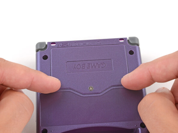 How to Reshell Your Game Boy Advance SP, Install the battery cover: crwdns2935265:067crwdnd2935265:03crwdnd2935265:03crwdne2935265:0