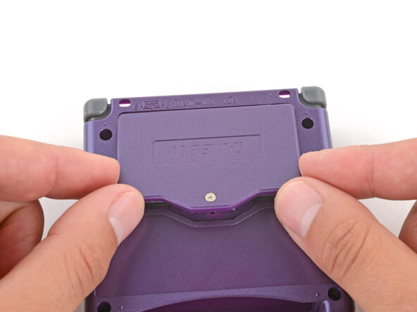 How to Reshell Your Game Boy Advance SP, Install the battery cover: crwdns2935265:067crwdnd2935265:02crwdnd2935265:03crwdne2935265:0