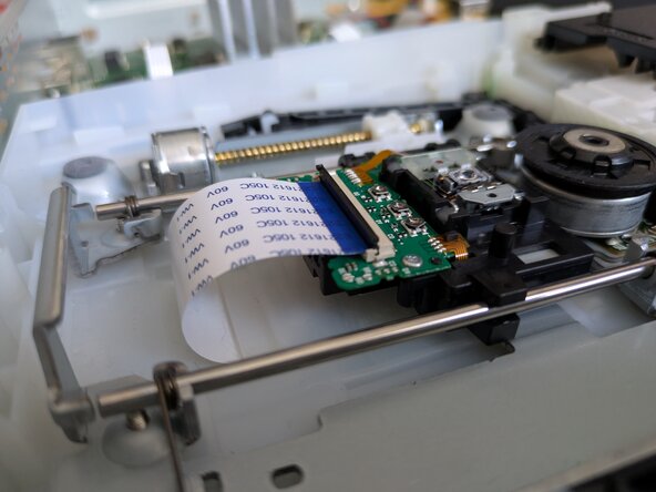 Panasonic DP-UB150-K Laser Replacement, Disconnect laser ribbon cable: crwdns2935265:07crwdnd2935265:02crwdnd2935265:03crwdne2935265:0