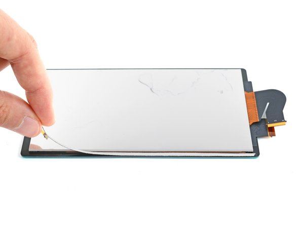 How to Replace the Screen Adhesive on Your Switch Lite, Apply the adhesive: crwdns2935265:04crwdnd2935265:03crwdnd2935265:03crwdne2935265:0