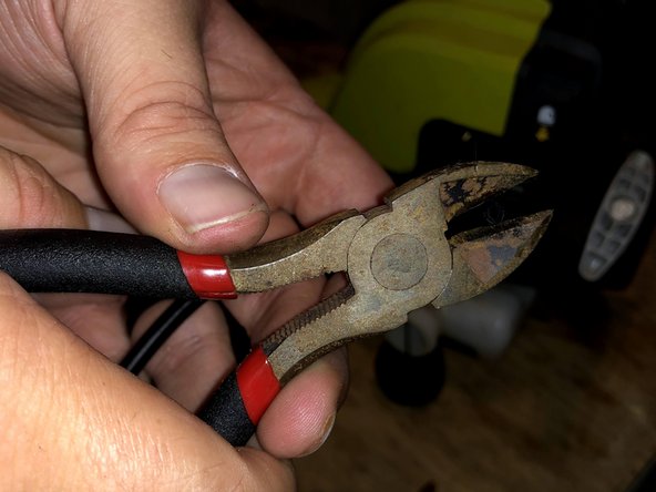 Use the cutting pliers to taper the end of the fuel line.