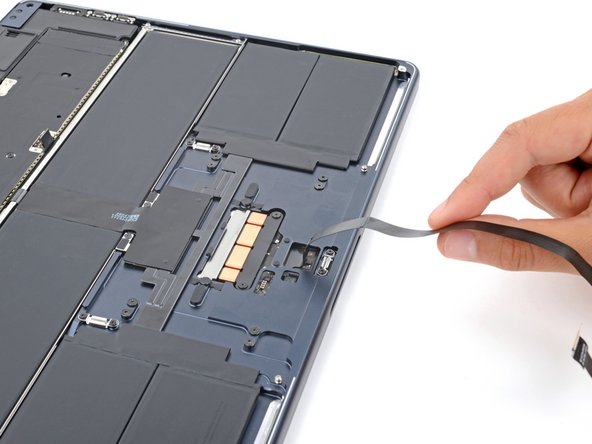 MacBook Air 15" 2024 Trackpad Replacement, Separate the trackpad cable adhesive: crwdns2935265:016crwdnd2935265:03crwdnd2935265:03crwdne2935265:0