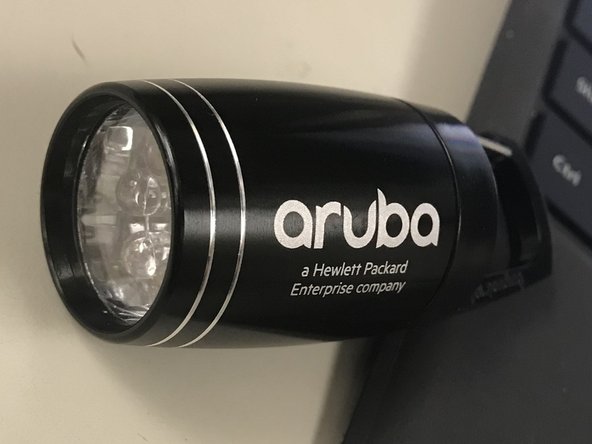 Career Fair Aruba Small Black Flashlight Teardown, Unscrew Top to View Battery Container: step 1, image 1 of 2