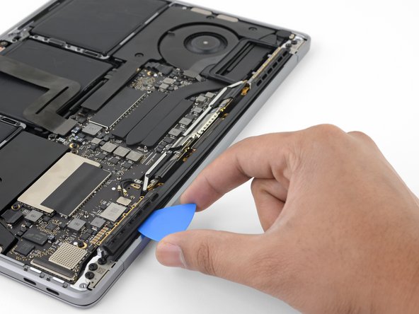 MacBook Pro 13" Function Keys 2017 Display Assembly Replacement, Unseat the antenna assembly: crwdns2935265:024crwdnd2935265:03crwdnd2935265:03crwdne2935265:0