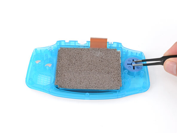 How to Reshell Your Game Boy Advance, Install the D‑pad and action buttons: crwdns2935265:024crwdnd2935265:01crwdnd2935265:03crwdne2935265:0