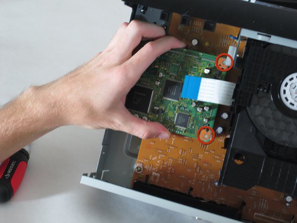 Removing Panasonic DVD-RV31 Player Motherboard: crwdns2935265:07crwdnd2935265:02crwdnd2935265:02crwdne2935265:0