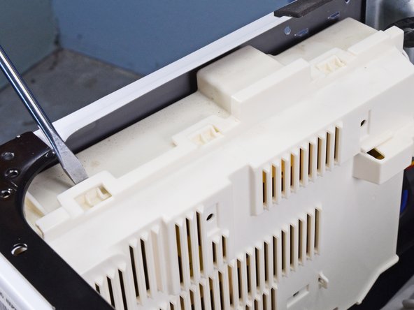 LG Front Load Washing Machine Main Board Replacement, Remove the main board cover: crwdns2935265:011crwdnd2935265:02crwdnd2935265:03crwdne2935265:0