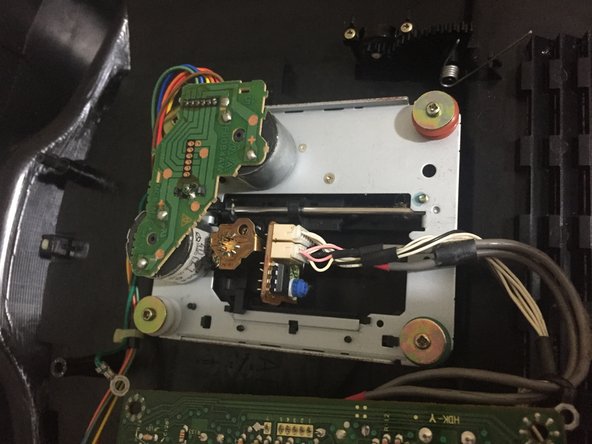 SNK Neo Geo CD Teardown, step 15: crwdns2935265:015crwdnd2935265:02crwdnd2935265:03crwdne2935265:0