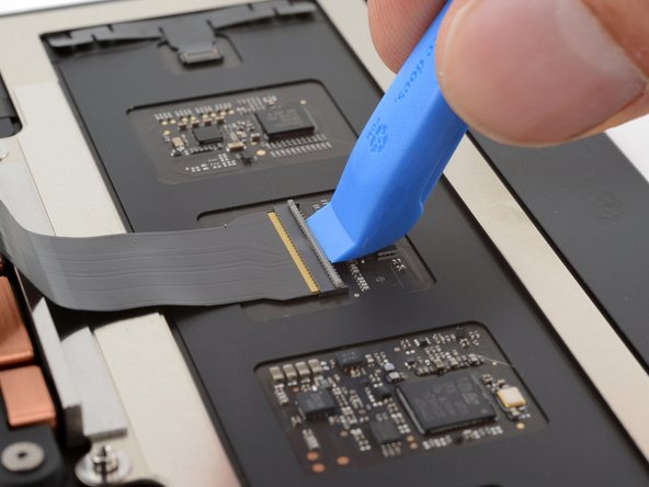 MacBook Pro 14" Late 2023 (M3) Trackpad Replacement, Unlatch the trackpad cable ZIF connector: crwdns2935265:025crwdnd2935265:02crwdnd2935265:02crwdne2935265:0