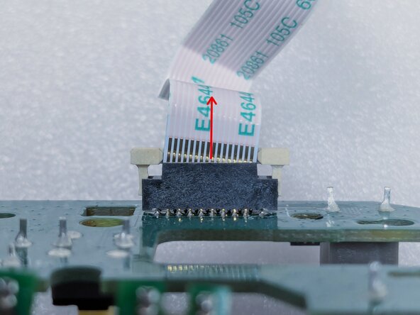 Logitech Lift Teardown, Detaching Ribbon Cable from Switch Board: crwdns2935265:020crwdnd2935265:02crwdnd2935265:02crwdne2935265:0