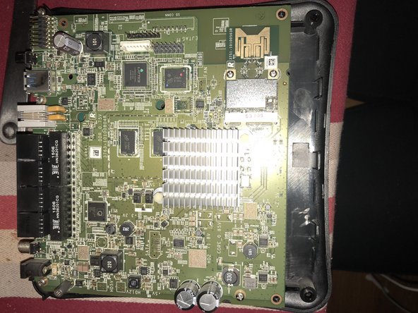 exede internet router Teardown, unscrew board from plastic cover: step 3, image 2 of 3