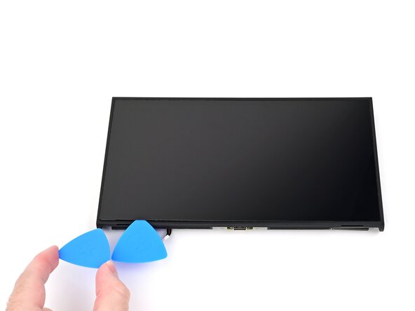 Nintendo Switch 2 Screen Replacement, Separate the left adhesive: crwdns2935265:050crwdnd2935265:01crwdnd2935265:03crwdne2935265:0