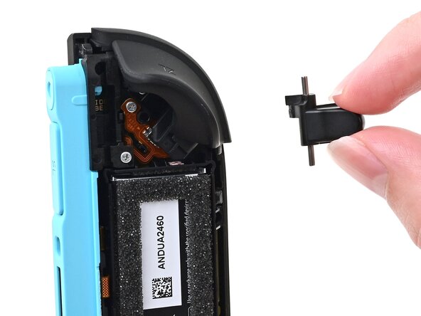 Joy-Con 2 (Left) Battery Replacement, Remove the release button: crwdns2935265:012crwdnd2935265:02crwdnd2935265:02crwdne2935265:0