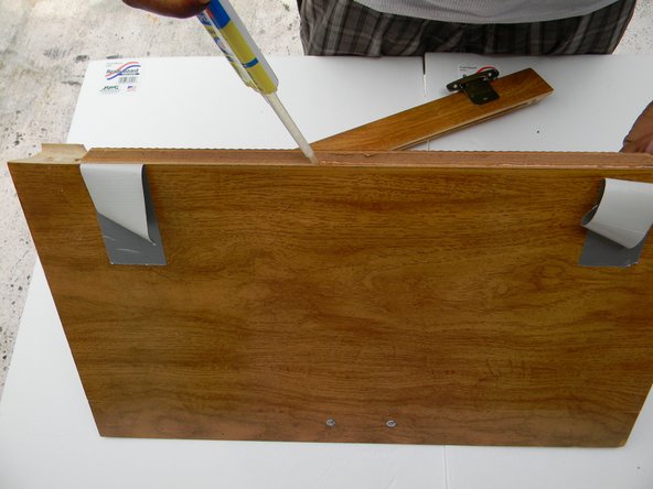 Run a thick bead of epoxy on the inside rim of the cabinet from one end to the other.