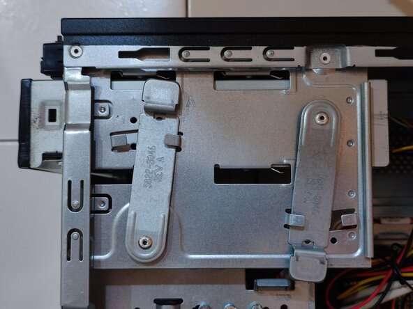 DVD Drive Removal, Release the DVD drive locking clip: step 3, image 2 of 2