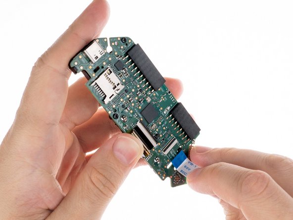 Flipper Zero Button Replacement, Remove the ribbon cable: crwdns2935265:09crwdnd2935265:02crwdnd2935265:02crwdne2935265:0