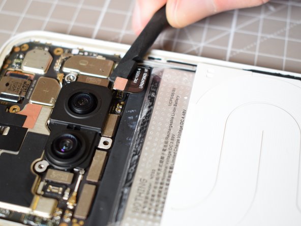 Nothing Phone (2a) Battery Replacement, Disconnect the flex cable connecting the battery to the mainboard: crwdns2935265:011crwdnd2935265:02crwdnd2935265:02crwdne2935265:0