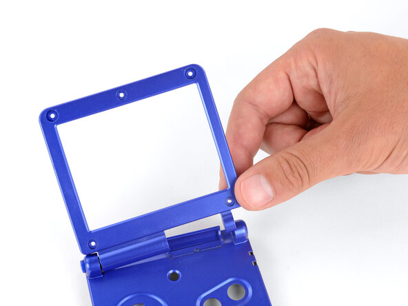 How to Reshell Your Game Boy Advance SP, Remove the screen bezel: crwdns2935265:030crwdnd2935265:02crwdnd2935265:03crwdne2935265:0