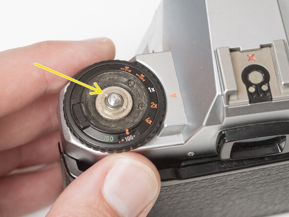 Pentax Super Program Top Cover Removal, Remove exposure compensation dial: crwdns2935265:03crwdnd2935265:02crwdnd2935265:03crwdne2935265:0