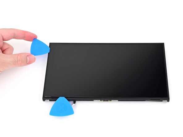 Nintendo Switch 2 Screen Replacement, Separate the left adhesive: crwdns2935265:050crwdnd2935265:03crwdnd2935265:03crwdne2935265:0
