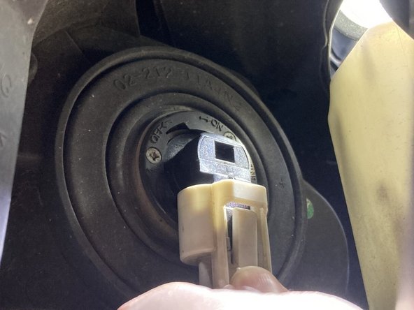 As you push down on the clip to release it, pull the clip off.