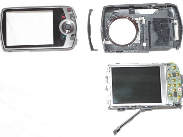 Repairing Casio Exilim EX-Z350 Lens mechanics, Remove camera from front housing: crwdns2935265:05crwdnd2935265:03crwdnd2935265:03crwdne2935265:0