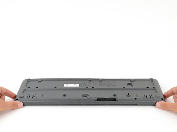 How to Open Your Logitech K295 Keyboard, Remove the bottom half: crwdns2935265:010crwdnd2935265:01crwdnd2935265:02crwdne2935265:0