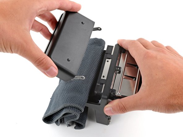 Polaroid Now Gen 3 Front Shell Replacement, Remove the film door: crwdns2935265:021crwdnd2935265:02crwdnd2935265:03crwdne2935265:0