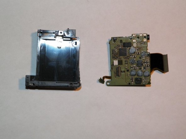 Canon PowerShot SD 600 Rear Accessory Board and Battery Compartment Replacement, Rear Accessory Board and Battery Compartment: crwdns2935265:028crwdnd2935265:03crwdnd2935265:03crwdne2935265:0