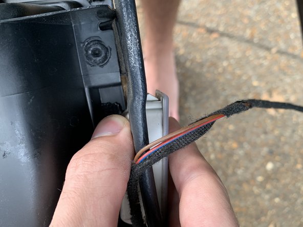 Pop the light out of the bottom of the door panel and then unplug it.