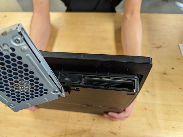 PlayStation 3 Slim Thermal Paste Replacement, Hard drive removal: crwdns2935265:04crwdnd2935265:03crwdnd2935265:03crwdne2935265:0