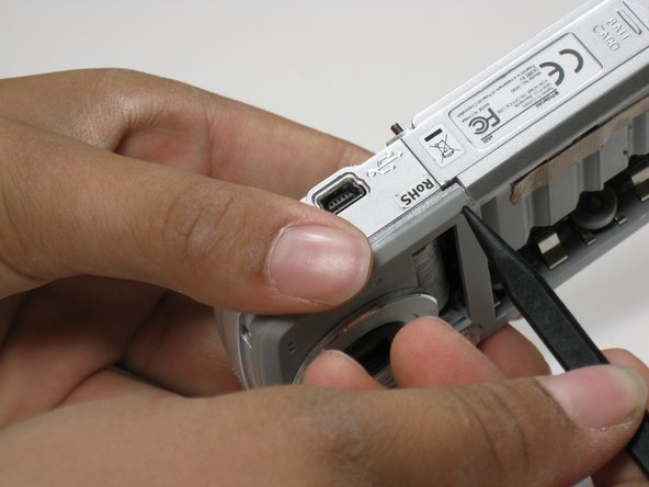 Disassembling Polaroid a520 Battery Cover: crwdns2935265:09crwdnd2935265:02crwdnd2935265:02crwdne2935265:0