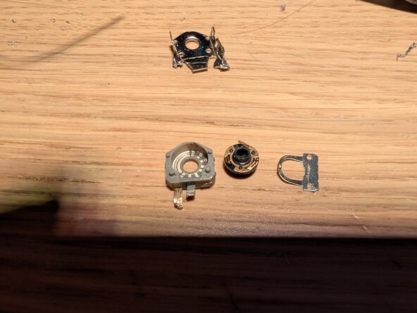 Replacing the scroll wheel encoder on the Logitech G403 Wired, (Optional) Clean the sensor: step 4, image 3 of 3